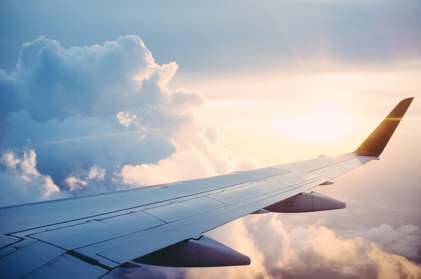 Aircraft wing above the clouds — medical repatriation